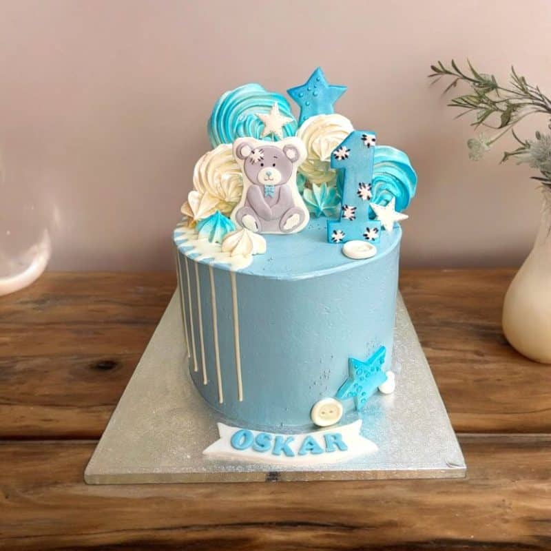 Blue Cake with a handmade teddy bear topper