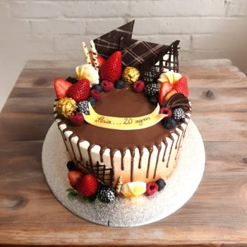 Drip Cake with fruits and chocolate decorations