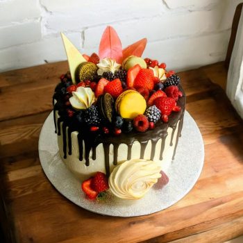 Chocolate Drip Cake with fruits and cookie decorations