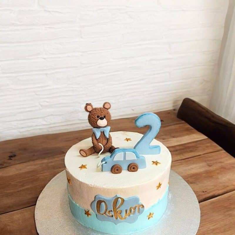 Blue Cake with a handmade teddy bear topper