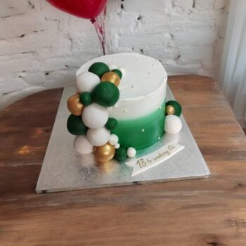 Bottle green, gold and white cake