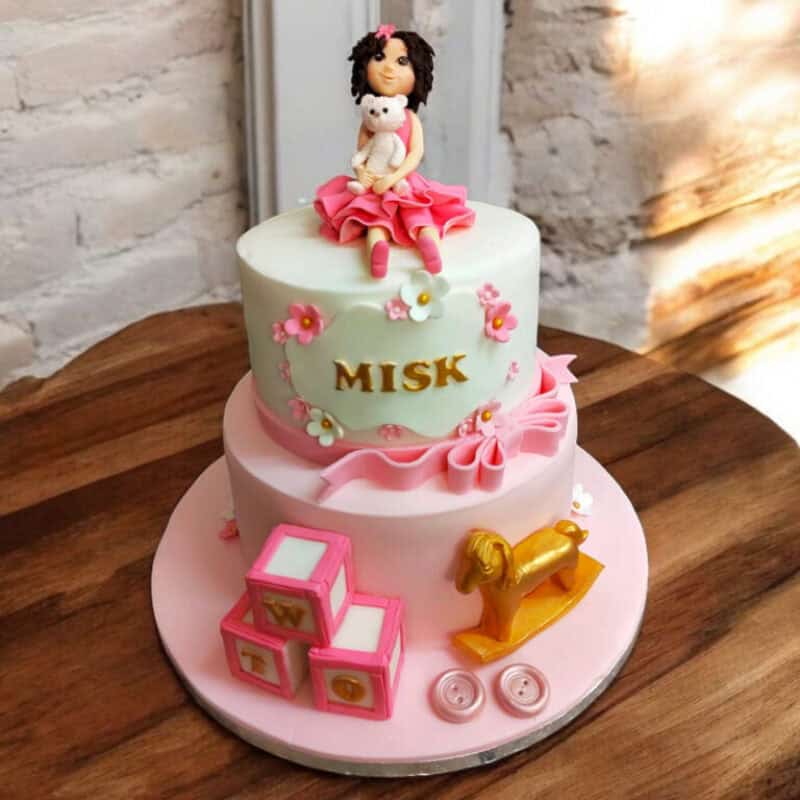 Two-Tier Cake with Personalized Girl Figurine
