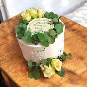 Elegant holy communion cake with fresh flowers & eucalyptus