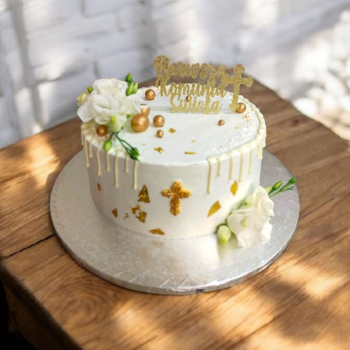 Elegant holy communion cake with fresh flowers