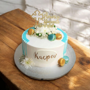 Elegant holy communion cake with fresh flowers and blue drip