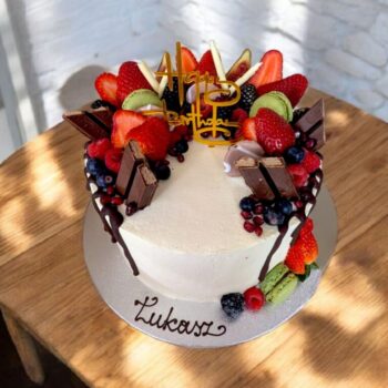 Cake with fruits and chocolate decorations