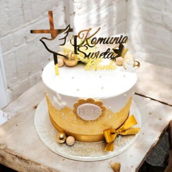 Elegant holy communion cake with fresh flowers and lace